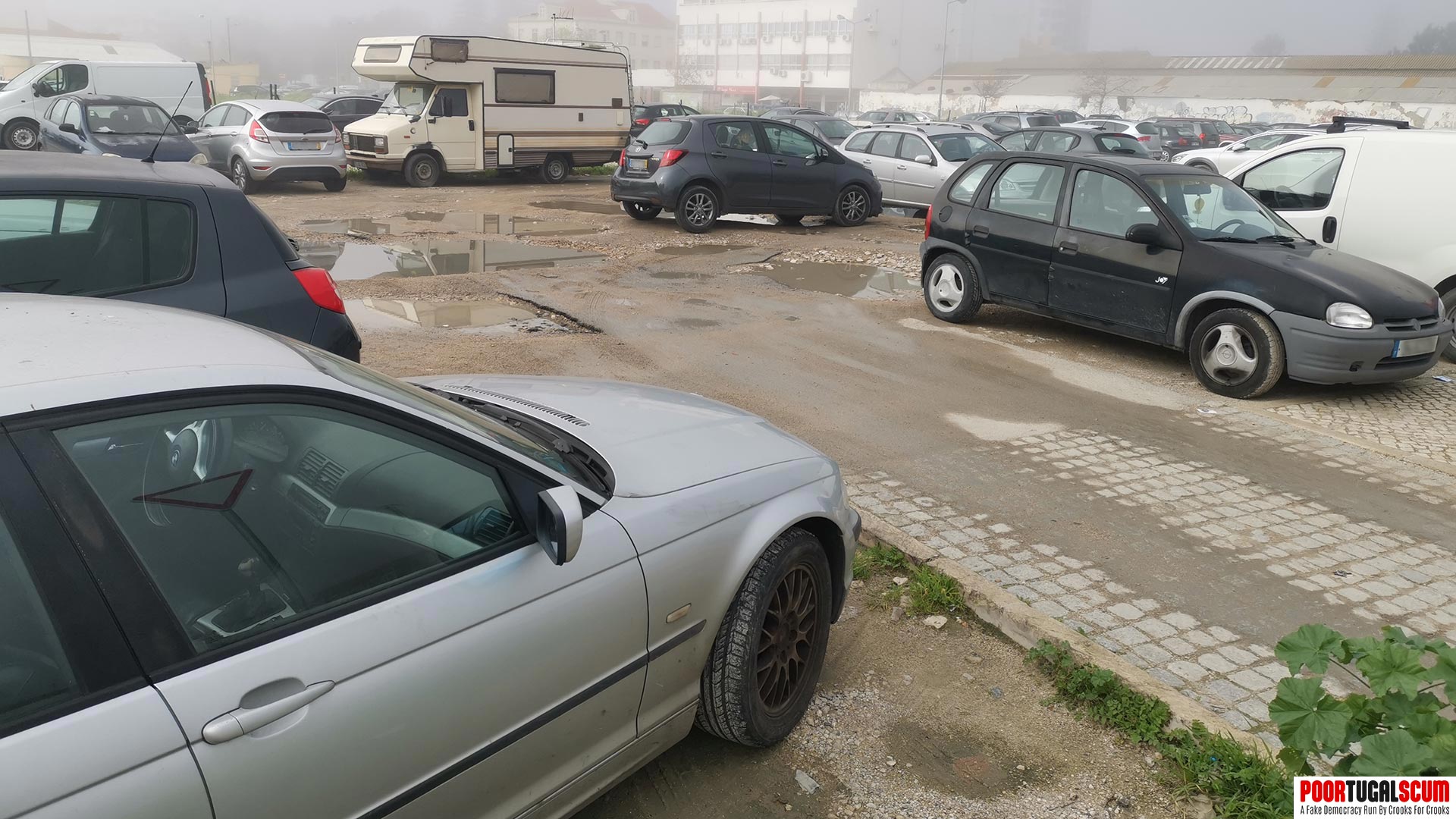 Portuguese car park full of decrepit cars